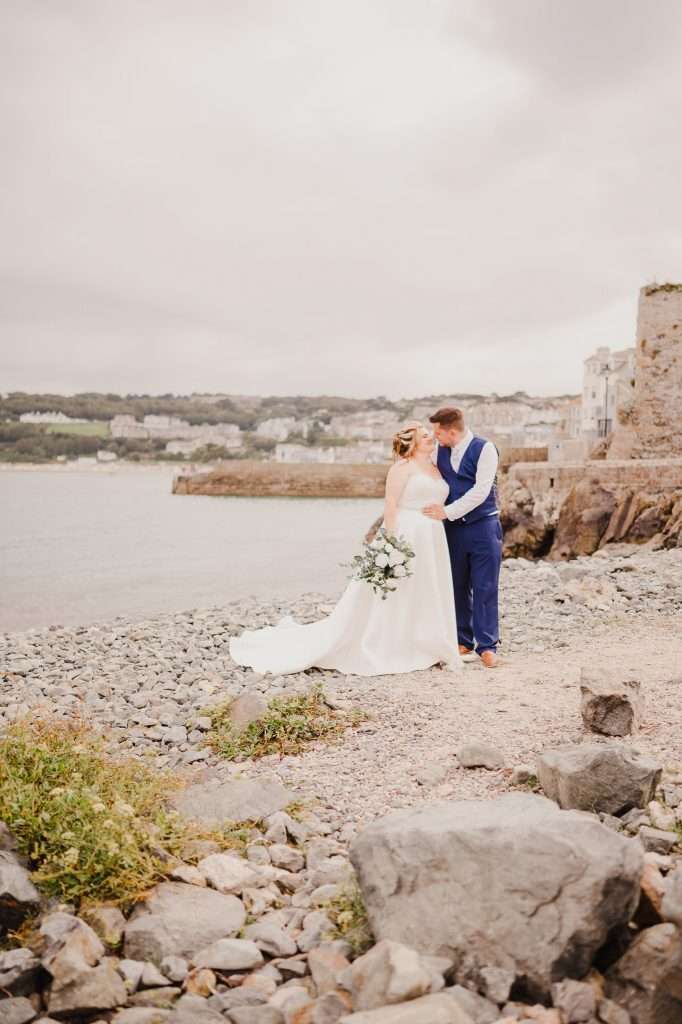 Wedding couple share a kiss on their wedding day at St Ives Chapel