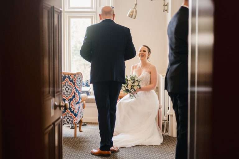 Brides laughing with father on her Spring Wedding At The Alverton, Truro, Cornwall