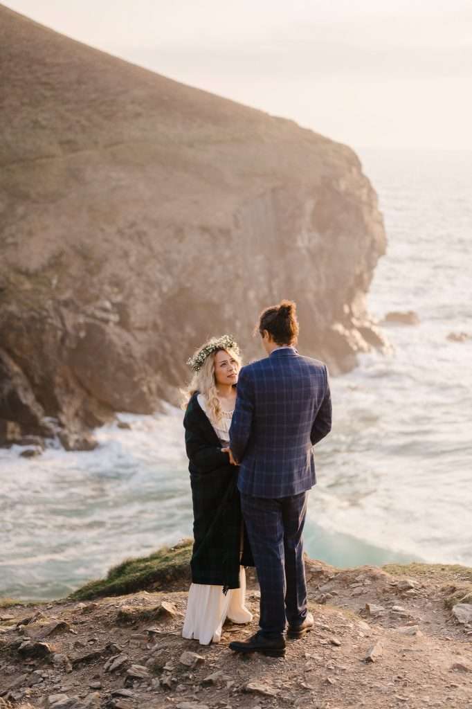 Couple eloped to Cornwall and enjoying a moment on the beautiful Cornwall coast - 4 Wedding Planning Tips To Organise Your Dream Wedding With Ease