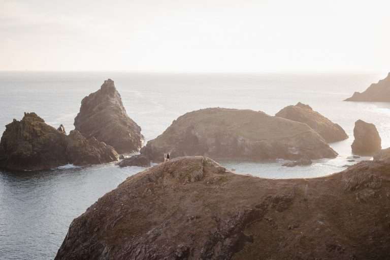 Engaged couple celebrate this chapter at Kynance Cove as the sun sets - Best Locations for an Engagement Photoshoot in Cornwall