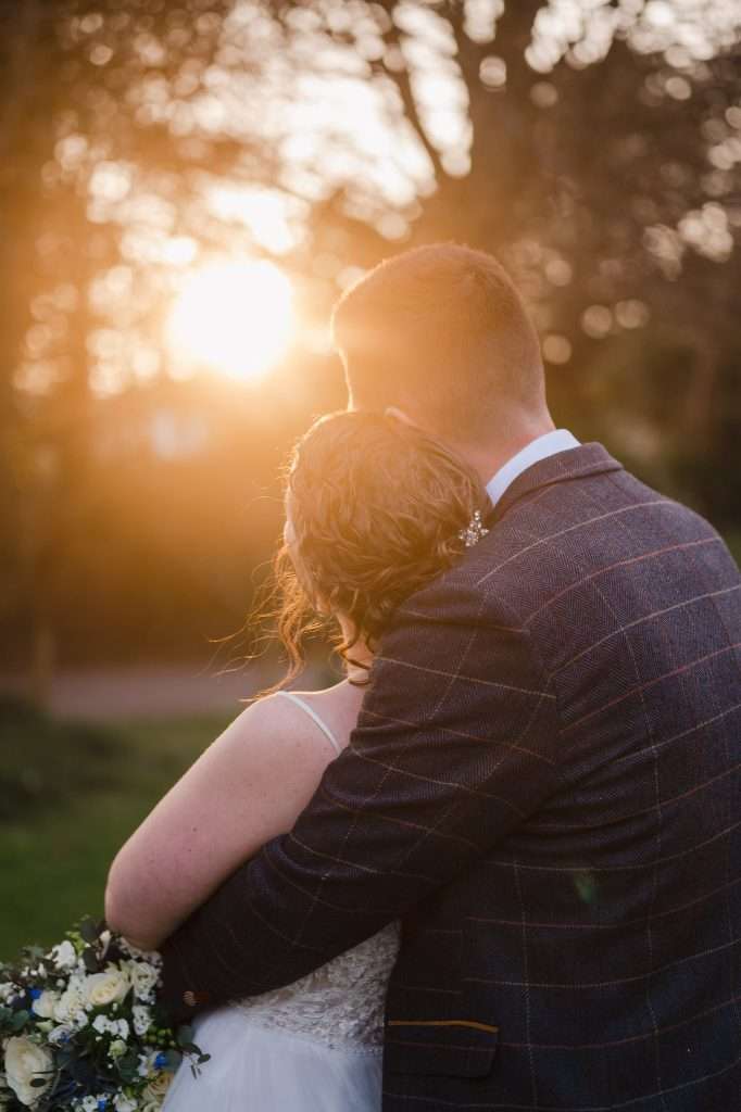 Wedding couple enjoying the sunset - 4 Wedding Planning Tips To Organise Your Dream Wedding With Ease