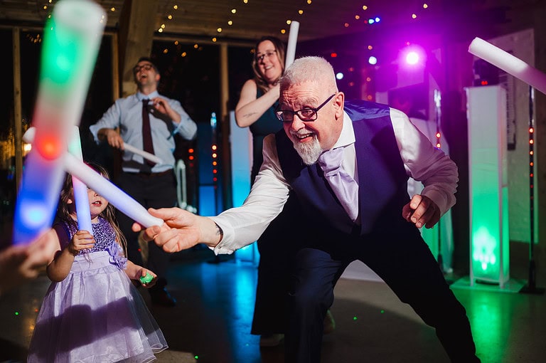 Wedding guests dancing on the dance floor 