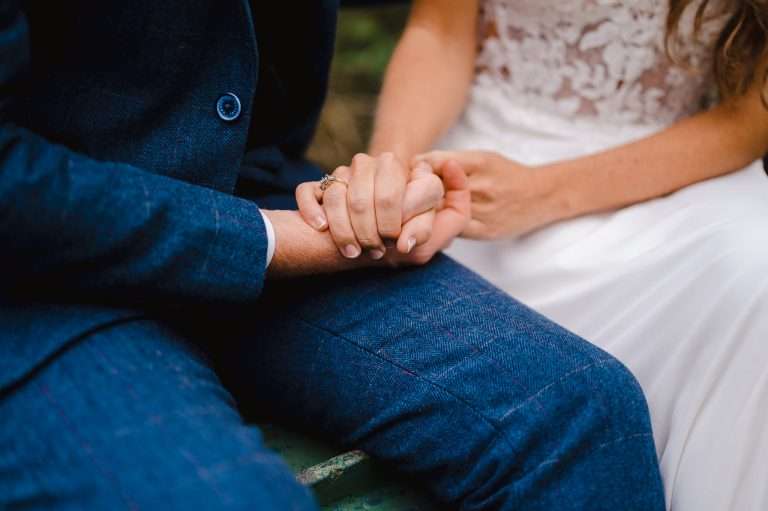 Wedding couple holding hands - What Is The Difference Between A Wedding Planner And A Wedding Designer?