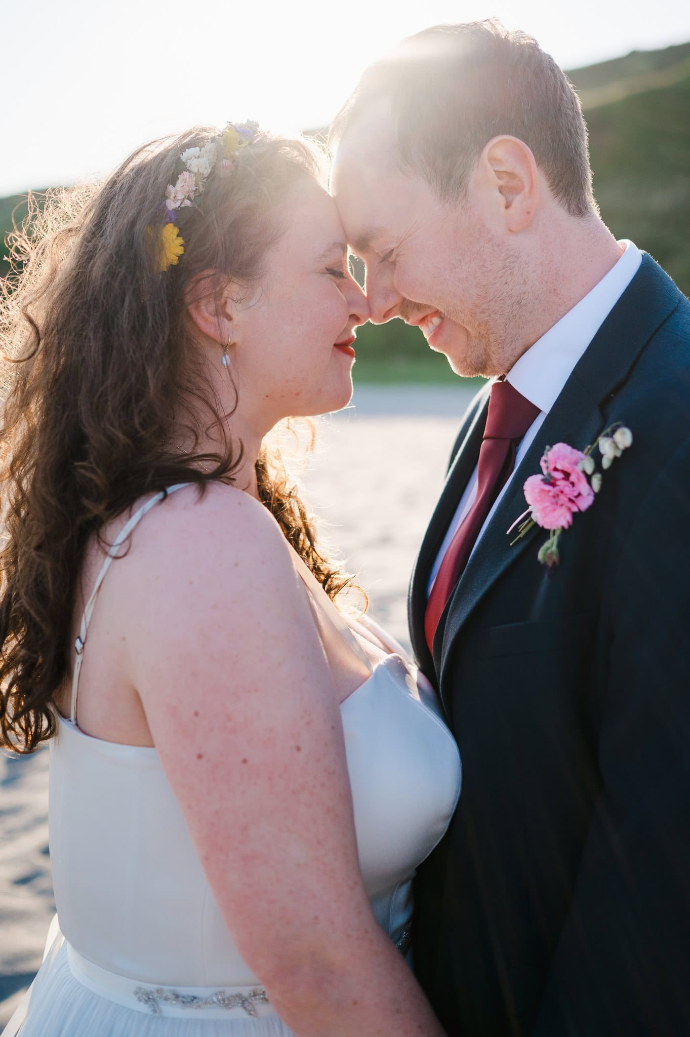 Wedding couple get close during couple photos