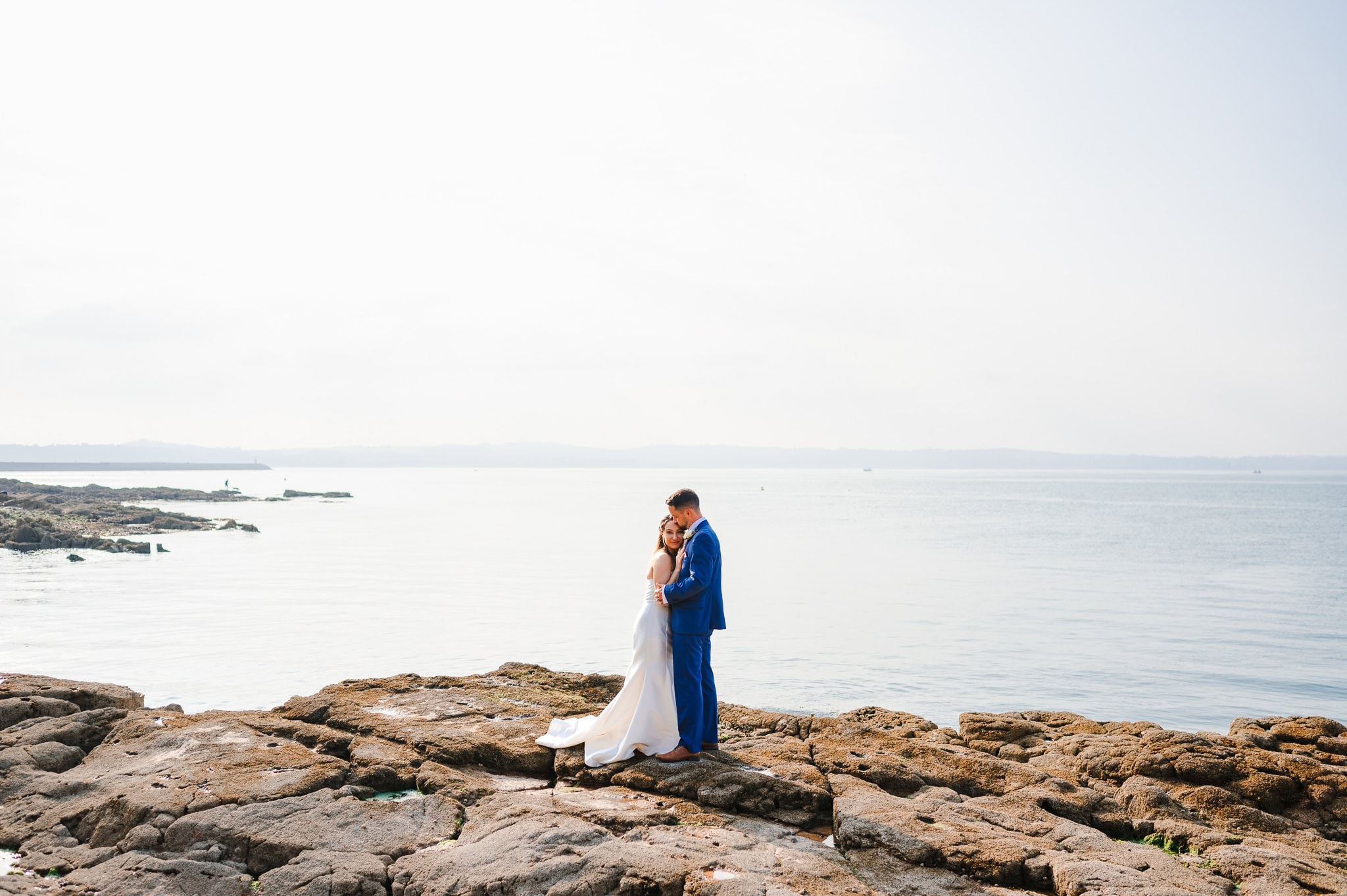 Standing out on the rocky tranquil Devon coast as the happy couple celebrate their love