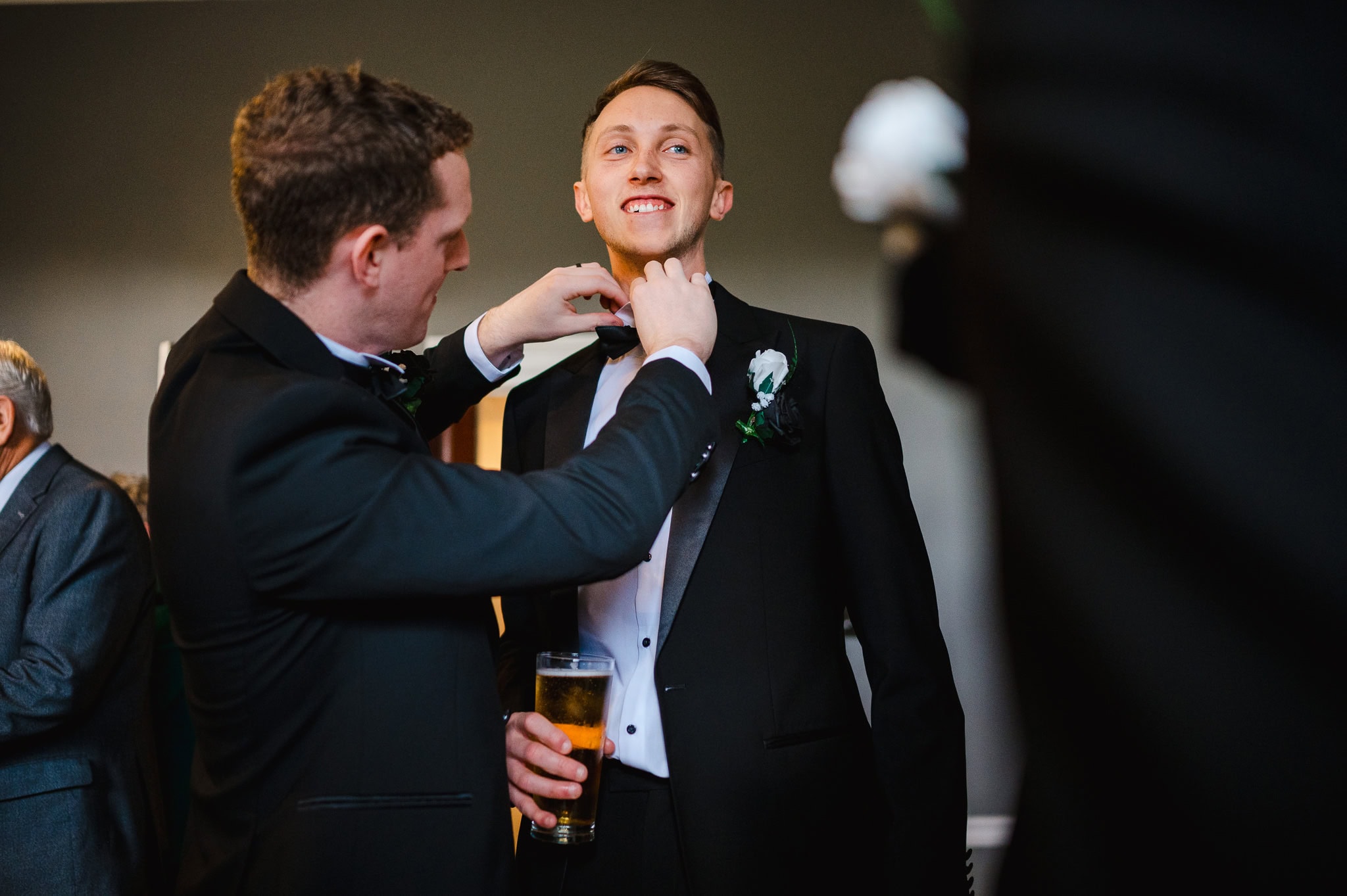 Groom and his party getting ready to celebrate the grooms wedding at Rockbeare Manor