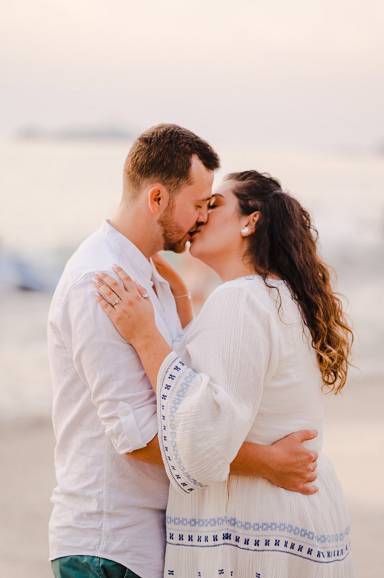 Take a kiss to celebrate your love for one another as the happy couple celebrate their engagement with amazing engagement photos by Cornwall Engagement Photographer, Jake Timms Photography