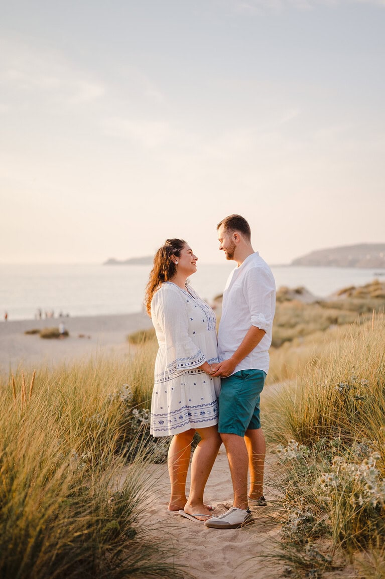 Looking into each others eyes as the sunsets over them with Godrevy lighthouse in the background