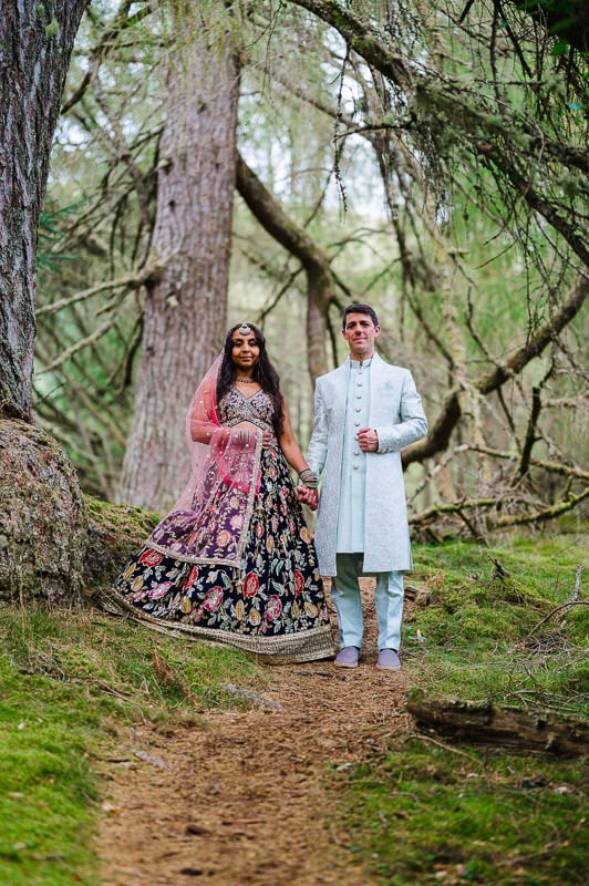 Holding each others hands tightly as they get their mantlepiece worthy wedding photo during the Scotland Elopement wedding celebrations - Scotland Elopement Portfolio