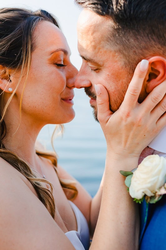 Bringing eachother in close for a kiss during couple photos