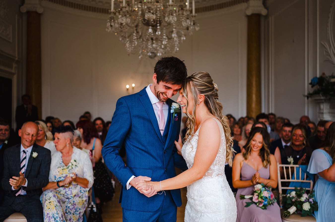 Laughing at the end of the wedding aisle
