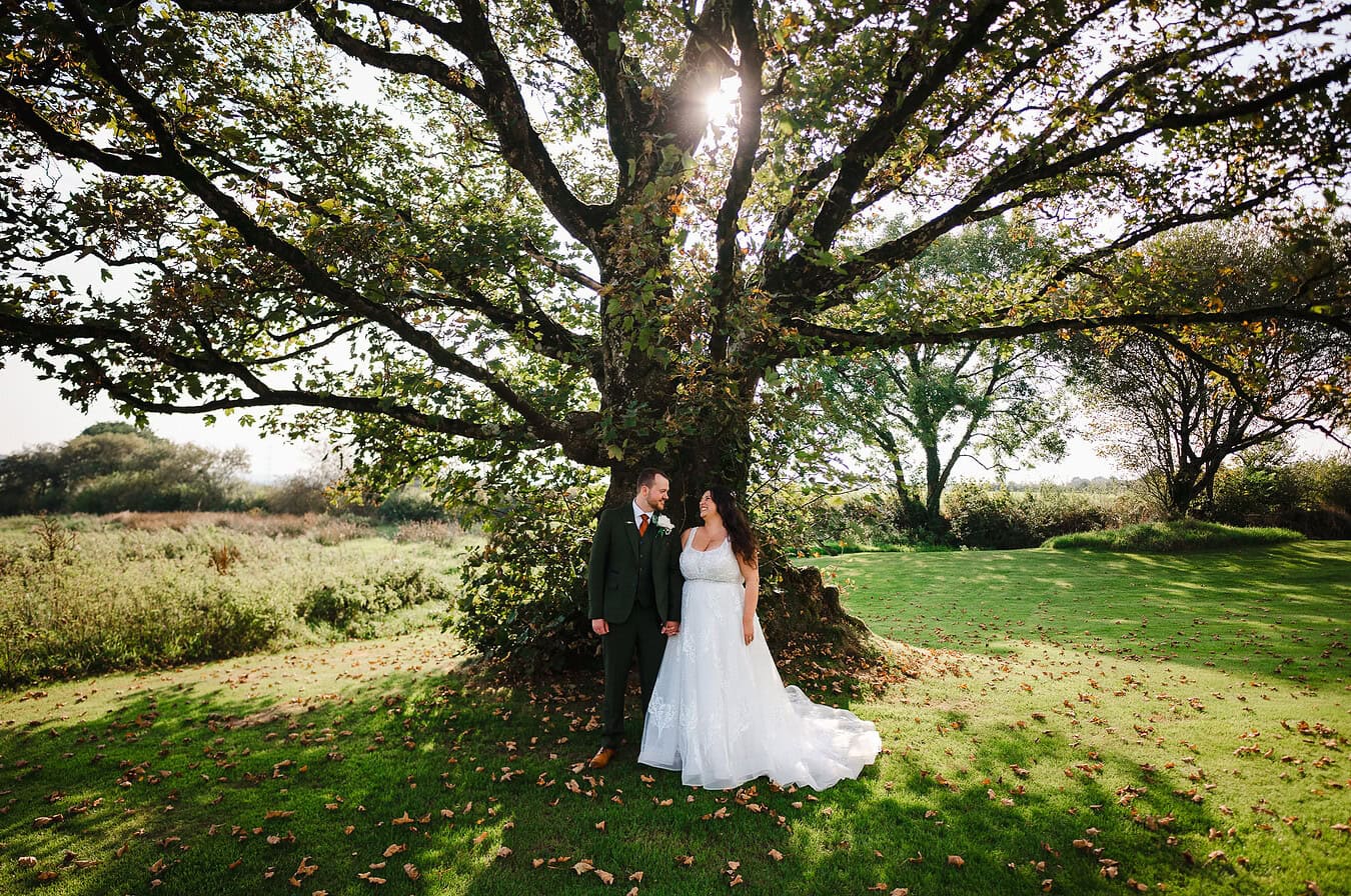 Looking into eachothers eyes during this happy couples autumn wedding day