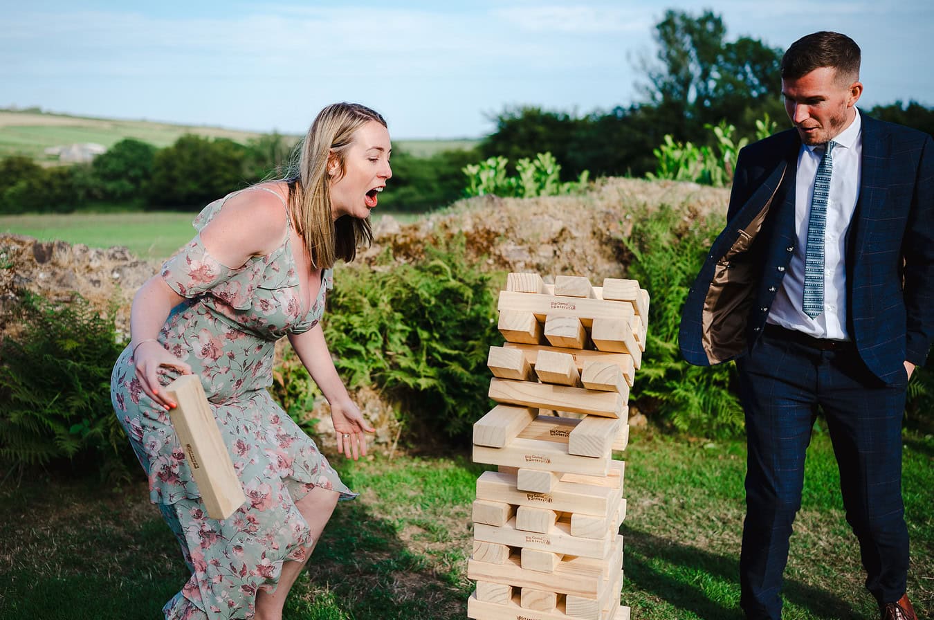 Wedding guests enjoying a game of jenga at Trevenna