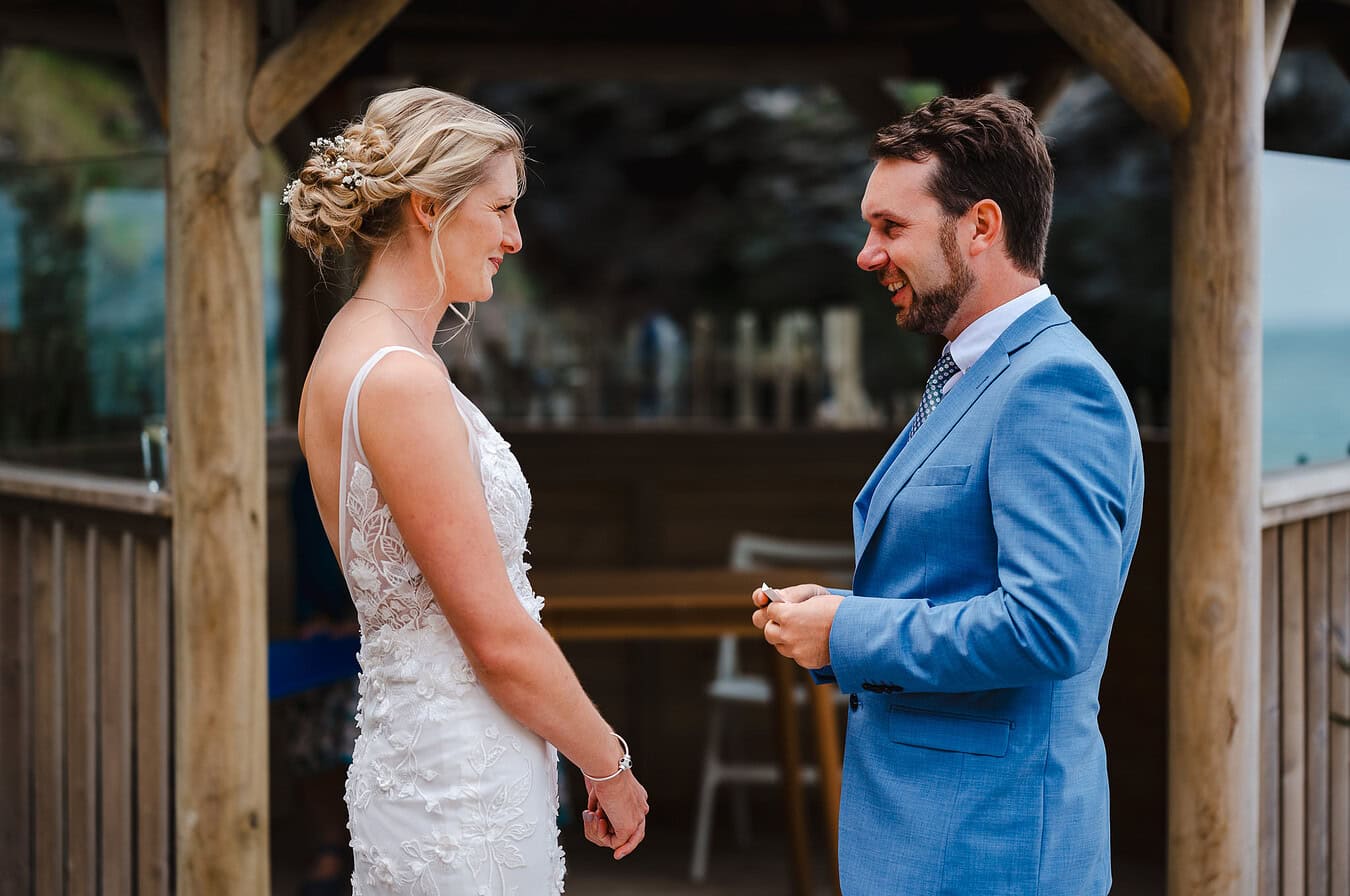 Saying your elopement wedding vows at Tunnels Beaches