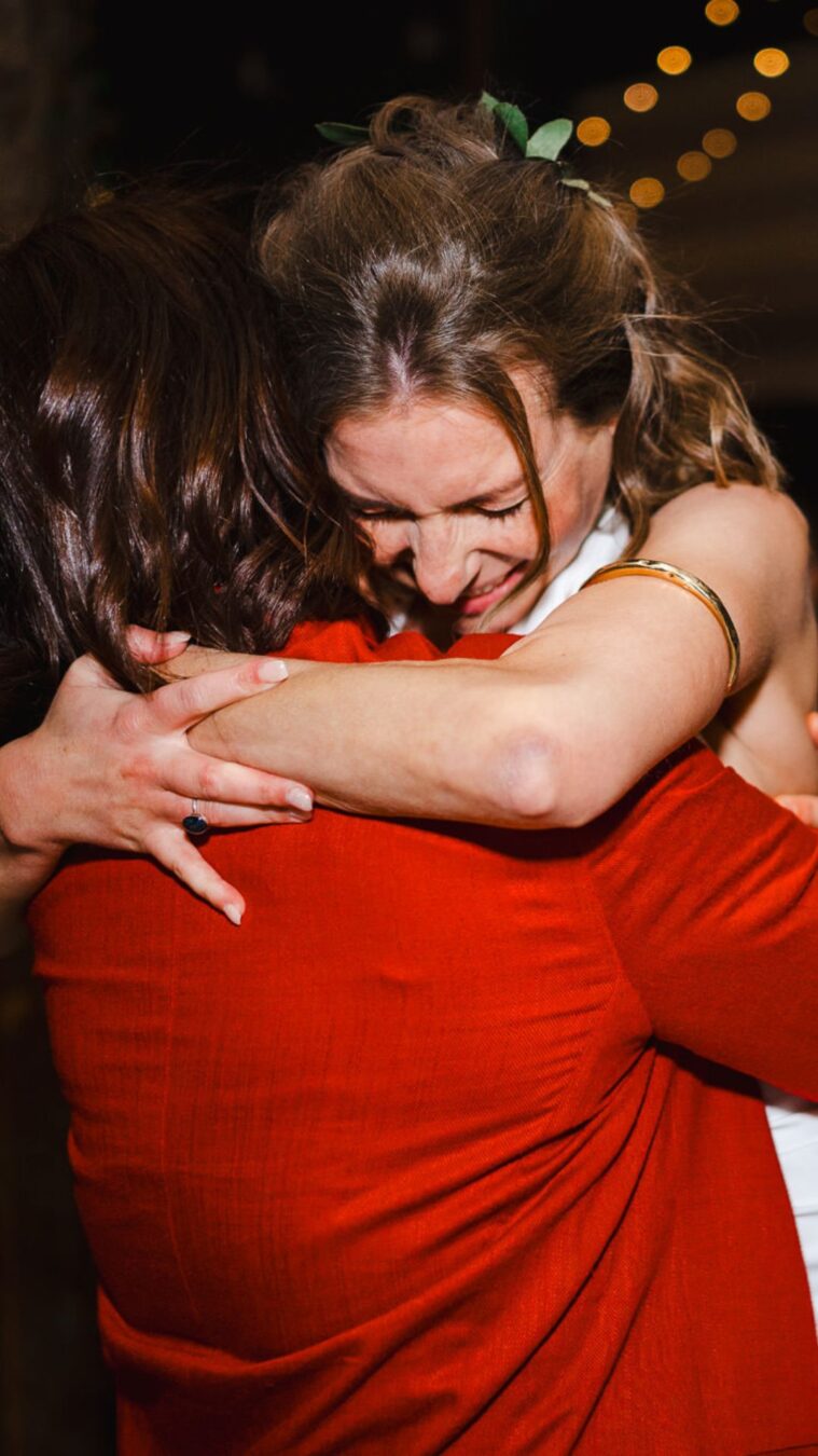 The bride hugs one of her best friends on her wedding day as the emotions of her wedding run wild by Cheshire Wedding Photographer, Jake Timms Photography